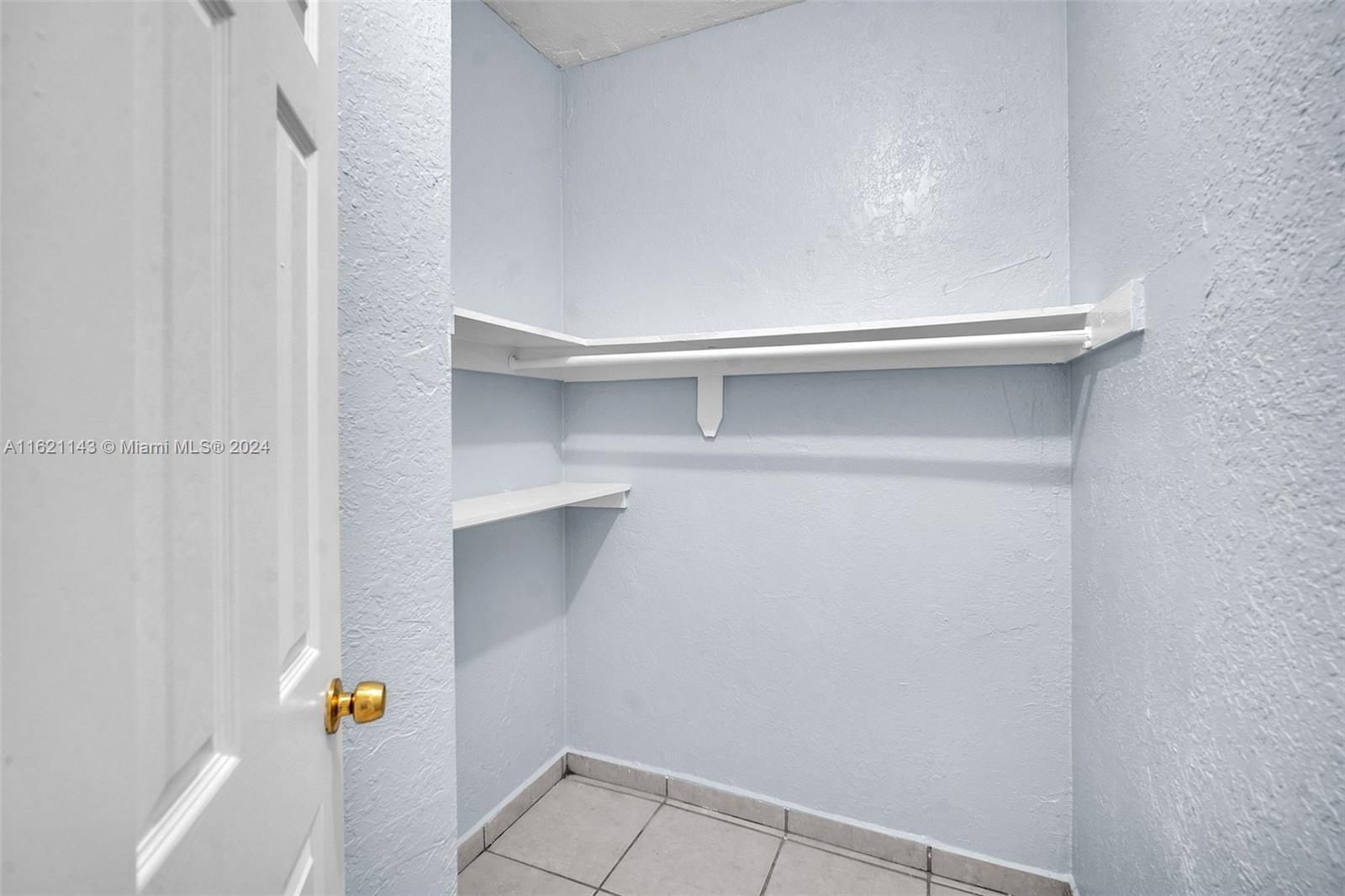 1350 West 53rd Street, Unit 12 Hialeah, FL 33012 - Photo 19 of 32 Walk-in closet in master bedroom
