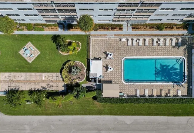 a front view of a building with garden