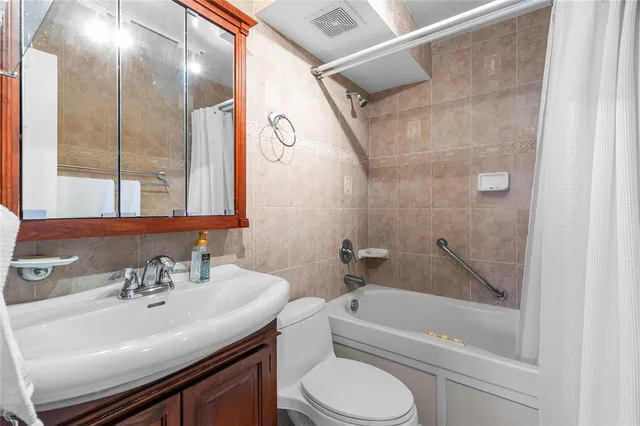 a bedroom with a bed and a lamp