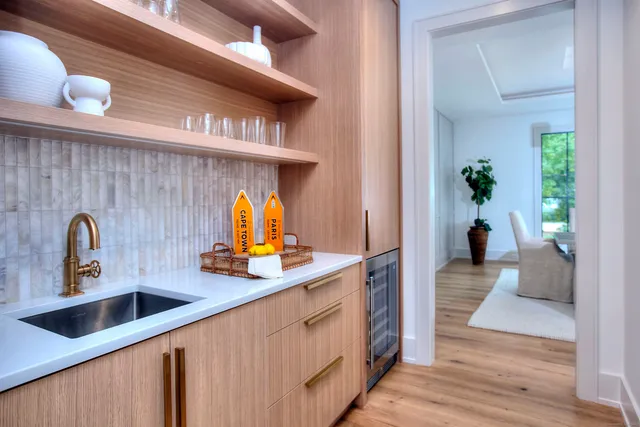 a kitchen with a sink and a refrigerator
