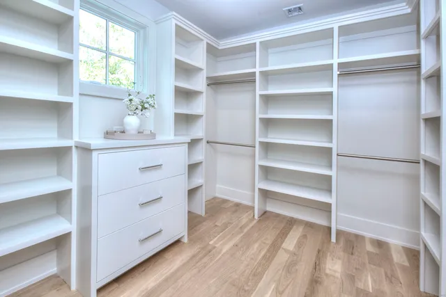 a room with a walk in closet with a window