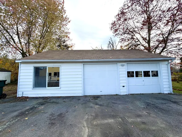 a view of house with garage