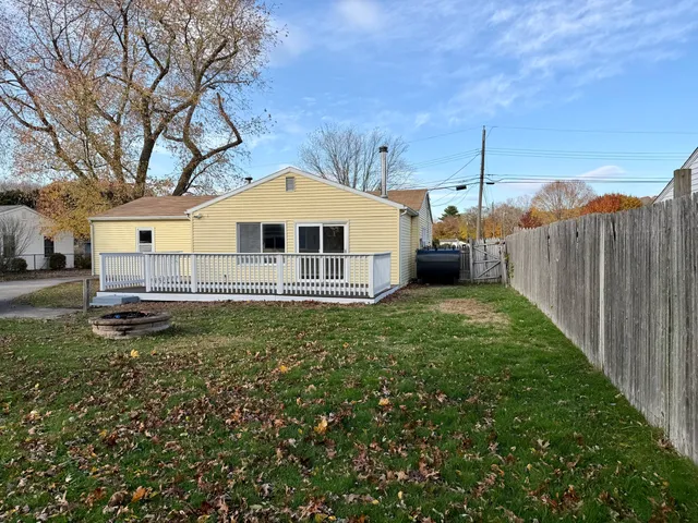 a front view of a house with a garden and yard