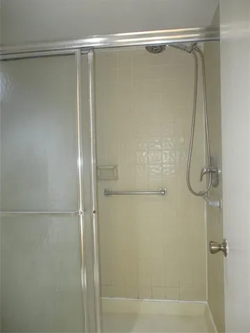 a bathroom with a sink vanity and a mirror