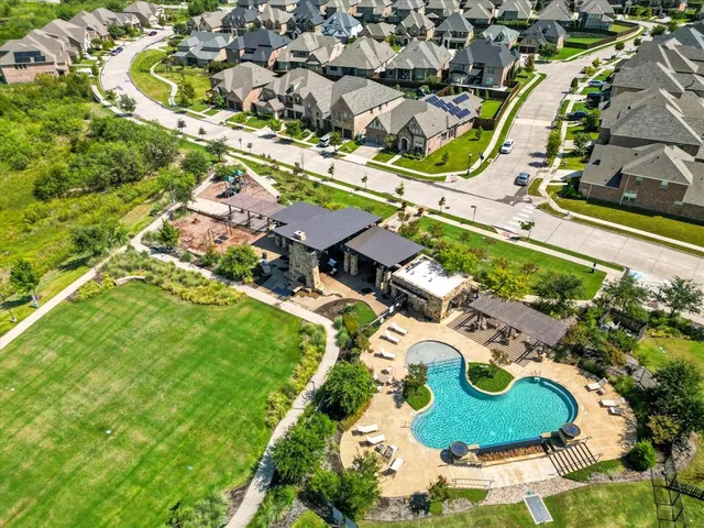 an aerial view of residential houses with outdoor space