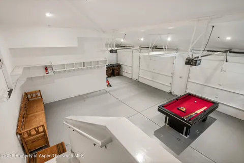a room with furniture and air hockey table
