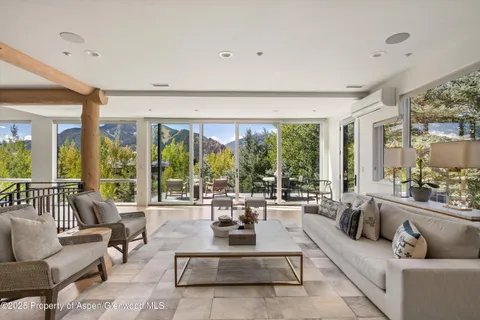 a living room with couch and a large window