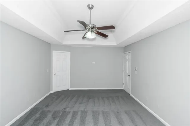 a view of a chandelier fan and entryway