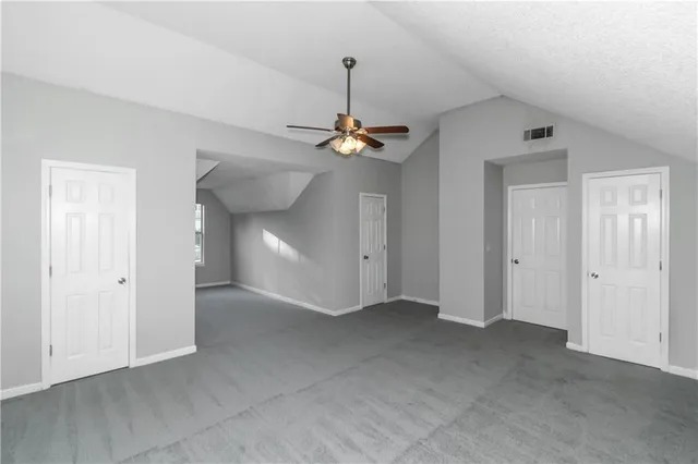 a view of a chandelier fan and closet in a room
