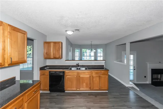 a kitchen with a stove and a sink