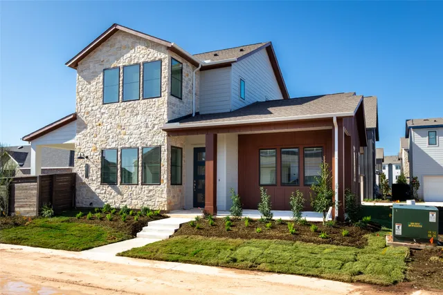 front view of a house with a yard