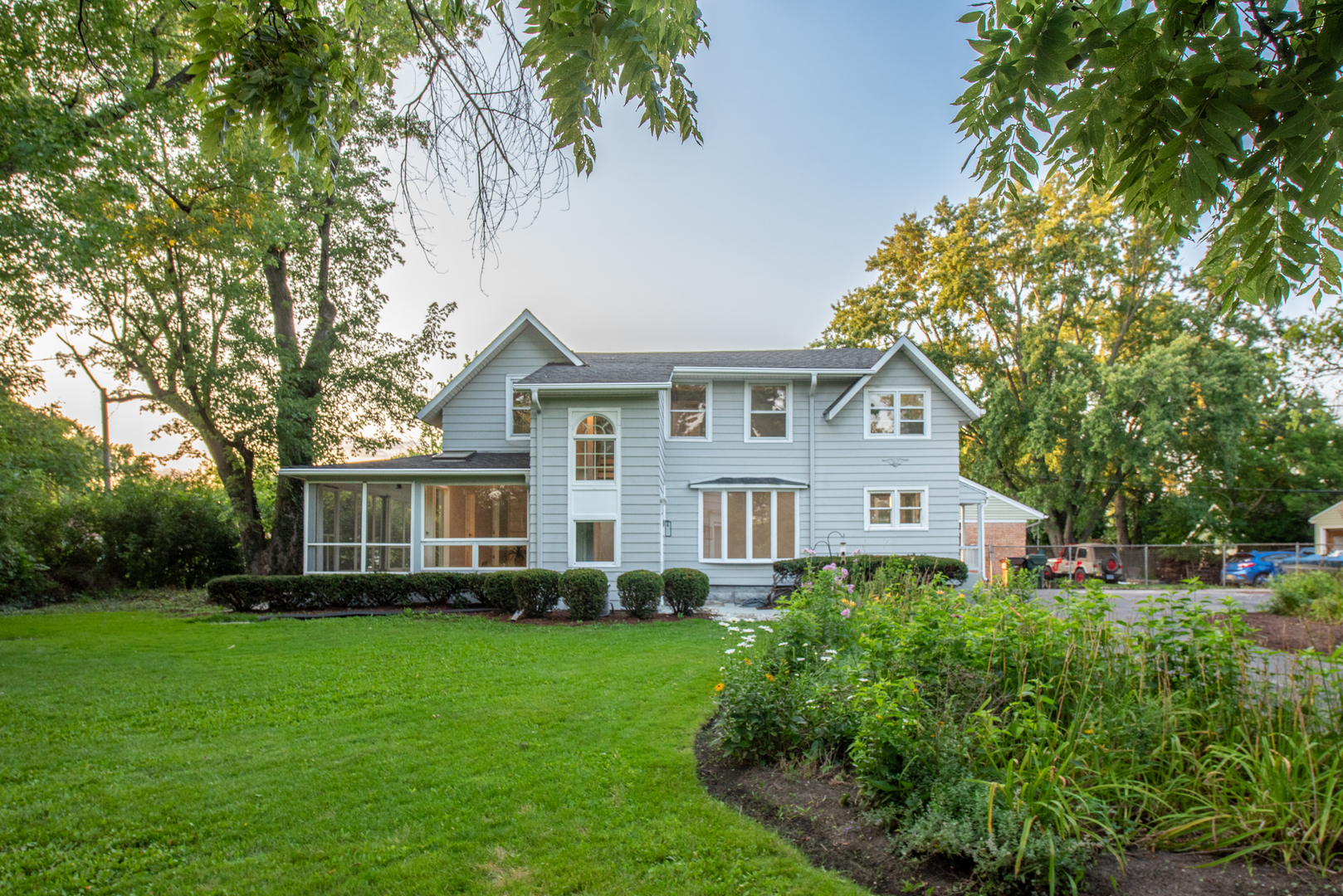 2360 Maple Road Homewood, IL 60430 - Photo 1 of 33 a front view of a house with a yard and trees