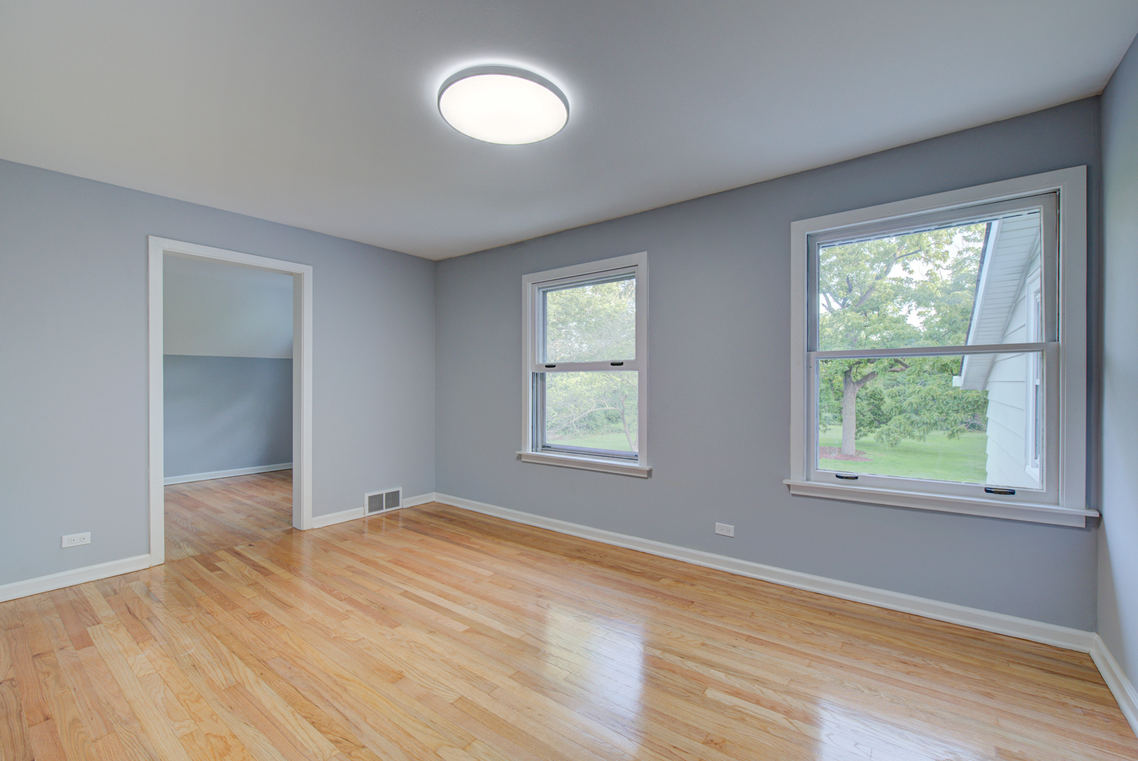 2360 Maple Road Homewood, IL 60430 - Photo 22 of 33 a view of an empty room with wooden floor and a window