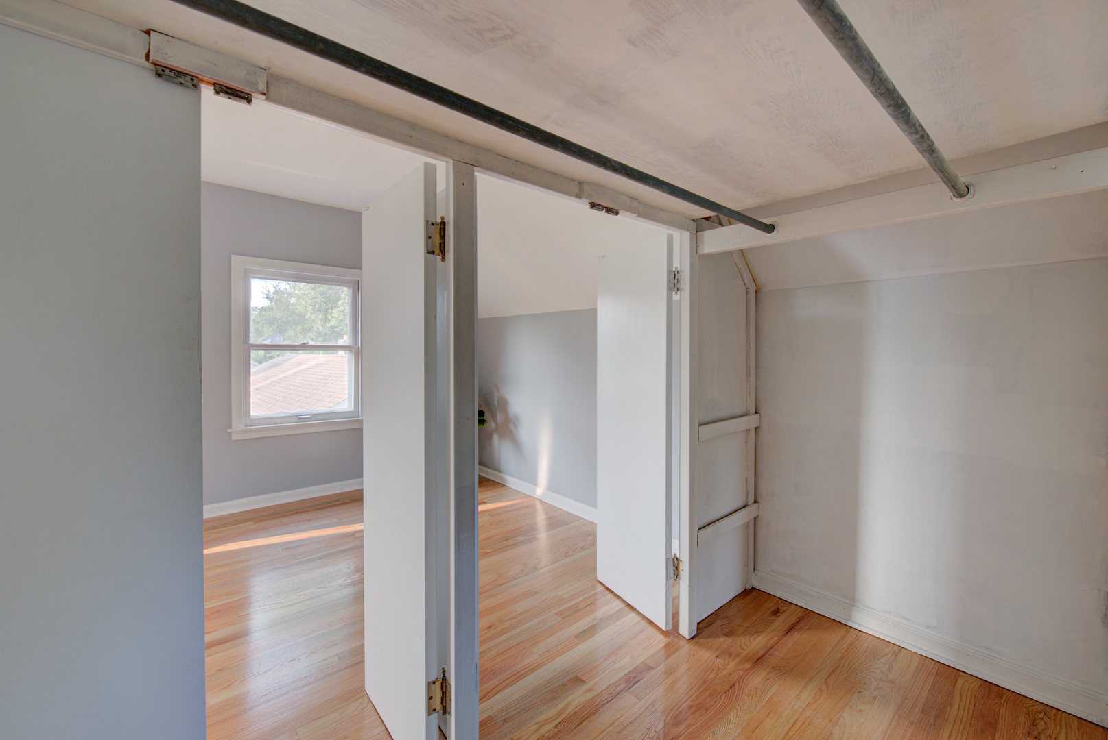 2360 Maple Road Homewood, IL 60430 - Photo 24 of 33 a view of an empty walk in closet with wooden floor