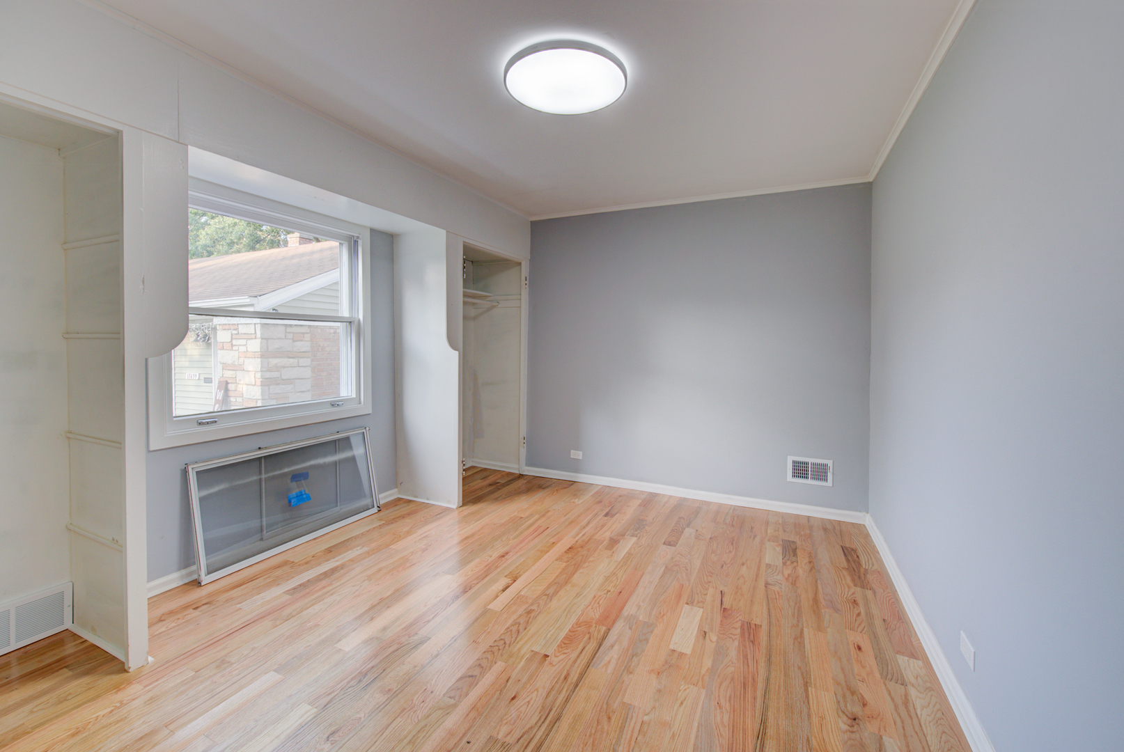 2360 Maple Road Homewood, IL 60430 - Photo 25 of 33 an empty room with wooden floor and windows