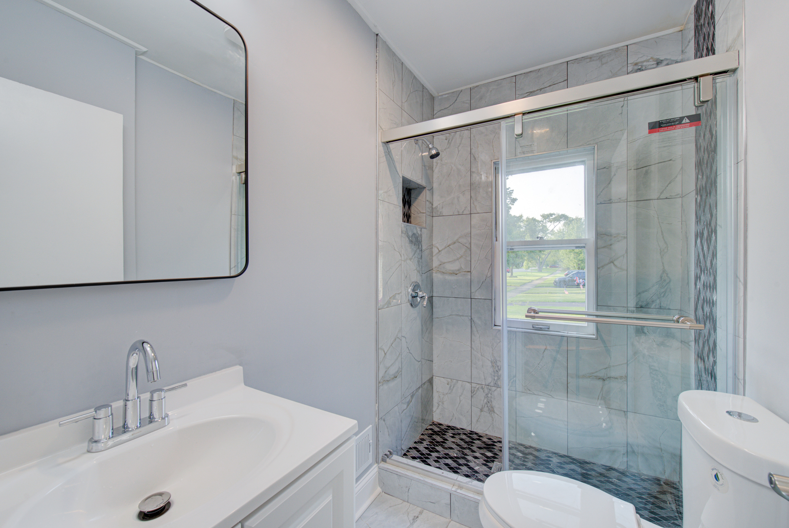 2360 Maple Road Homewood, IL 60430 - Photo 5 of 33 a bathroom with a sink toilet and shower