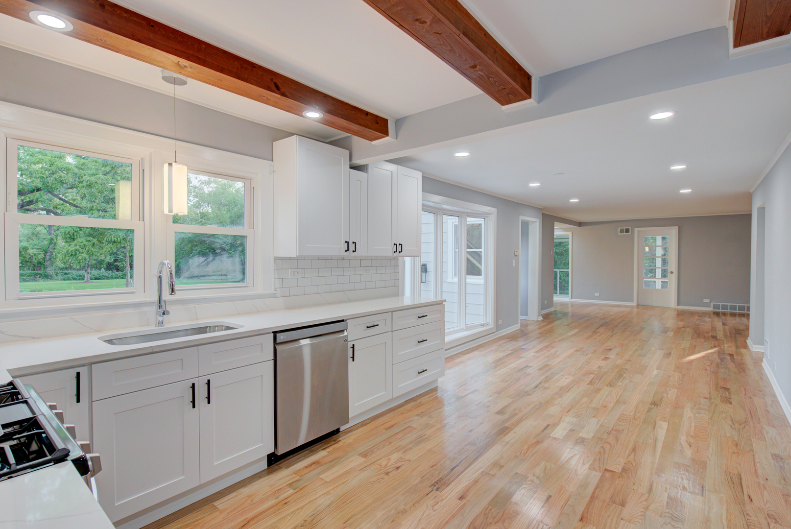 2360 Maple Road Homewood, IL 60430 - Photo 6 of 33 a large kitchen with granite countertop a sink and dishwasher with wooden floor