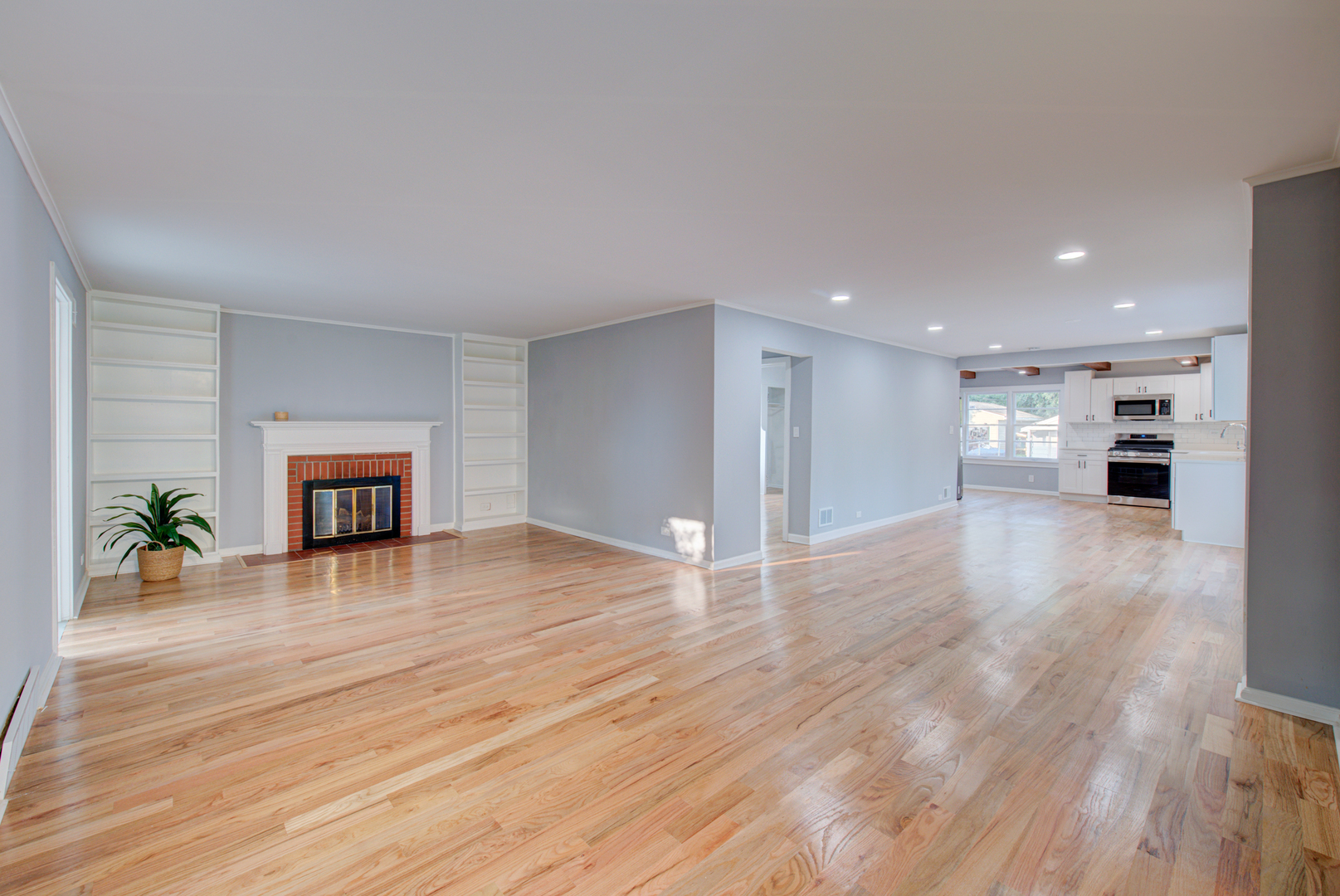 2360 Maple Road Homewood, IL 60430 - Photo 10 of 33 a view of empty room with wooden floor and kitchen