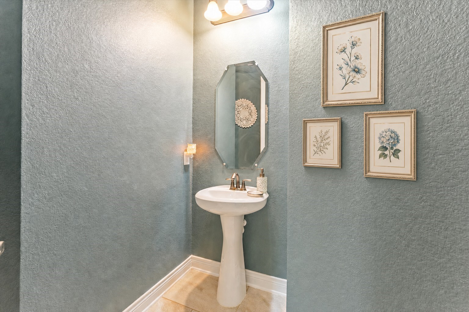 2506 Barclay Lake Lane Spring, TX 77388 - Photo 5 of 35 A charming powder room with a pedestal sink and vintage inspired mirror provides thoughtful style in every corner of this home. Virtually staged.