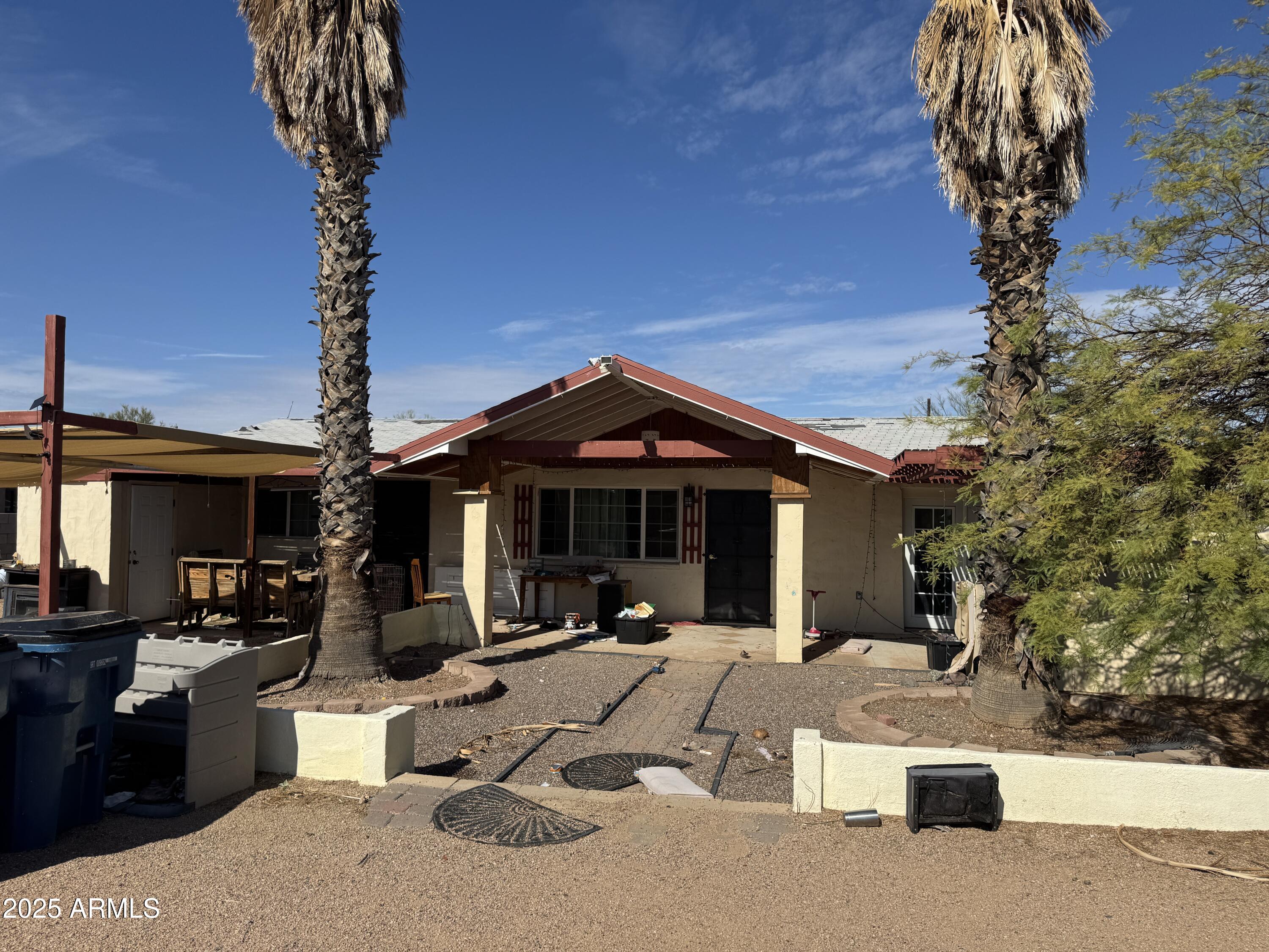 851 East Junction Street Apache Junction, AZ 85119 - Photo 2 of 13 a view of a patio with couches table and chairs and potted plants