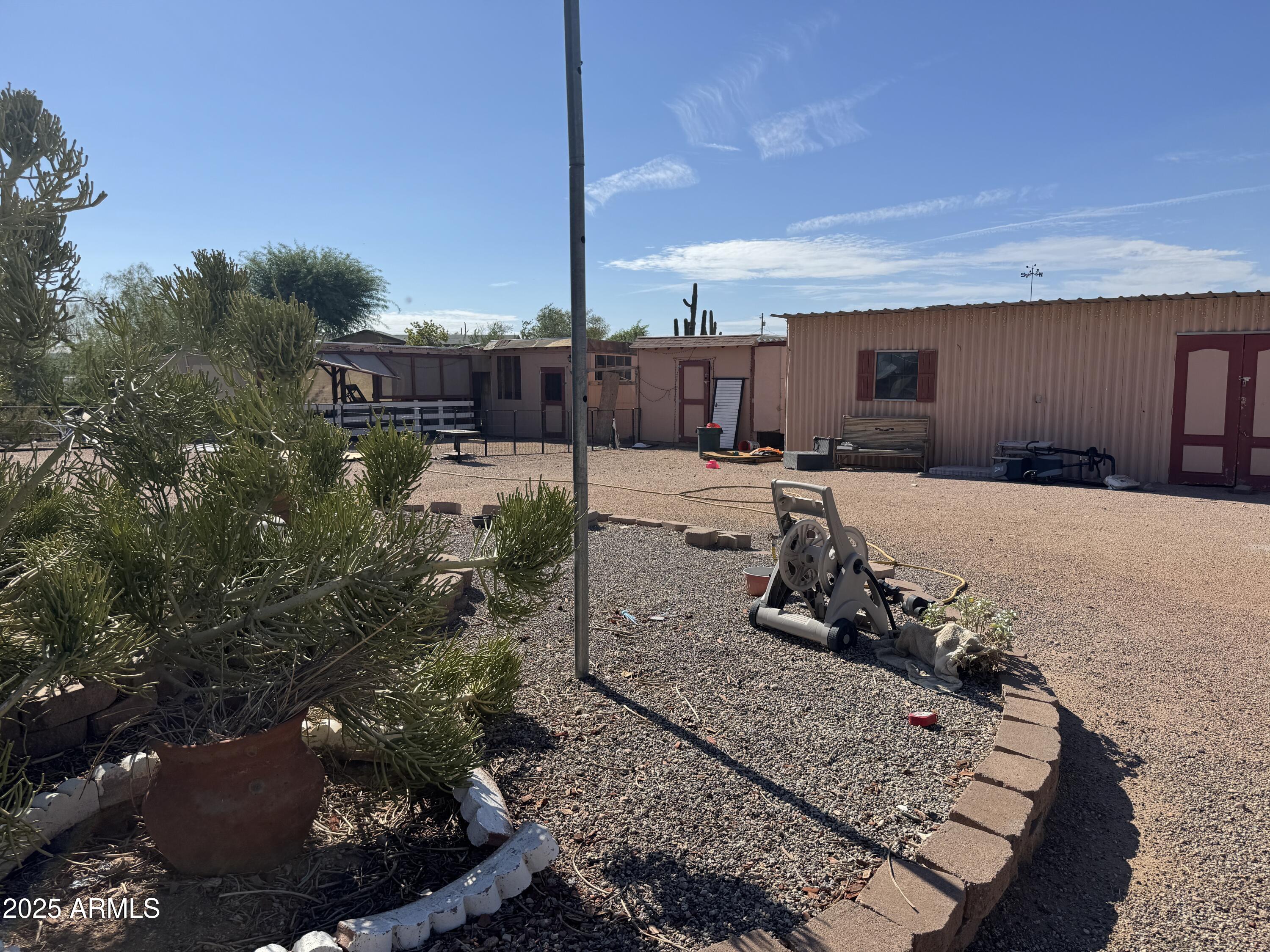 851 East Junction Street Apache Junction, AZ 85119 - Photo 3 of 13 a view of a backyard with sitting area