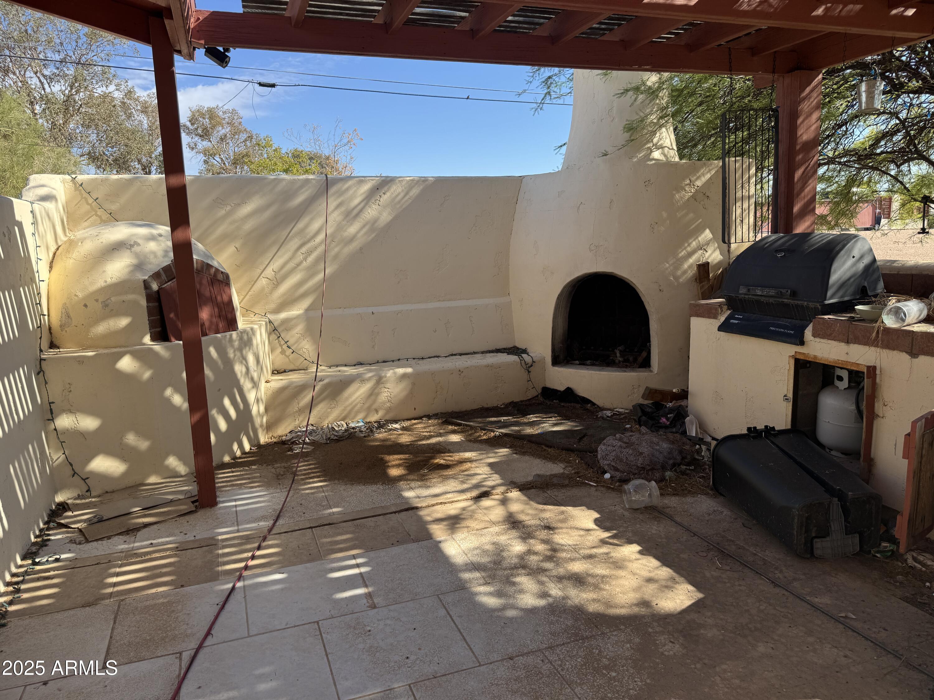 851 East Junction Street Apache Junction, AZ 85119 - Photo 6 of 13 a backyard of a house with yard and outdoor seating