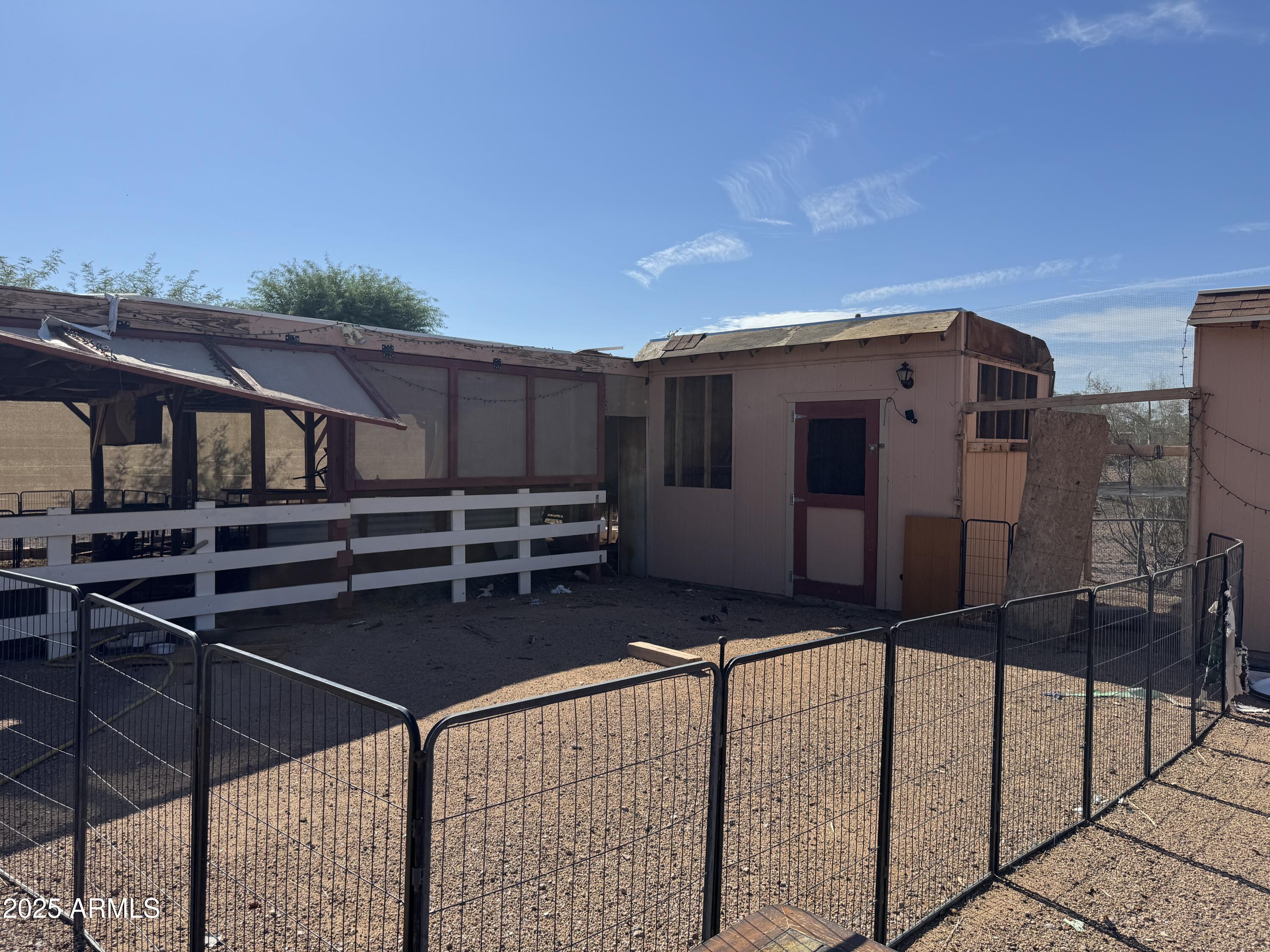851 East Junction Street Apache Junction, AZ 85119 - Photo 7 of 13 a view of a chairs and table in the backyard