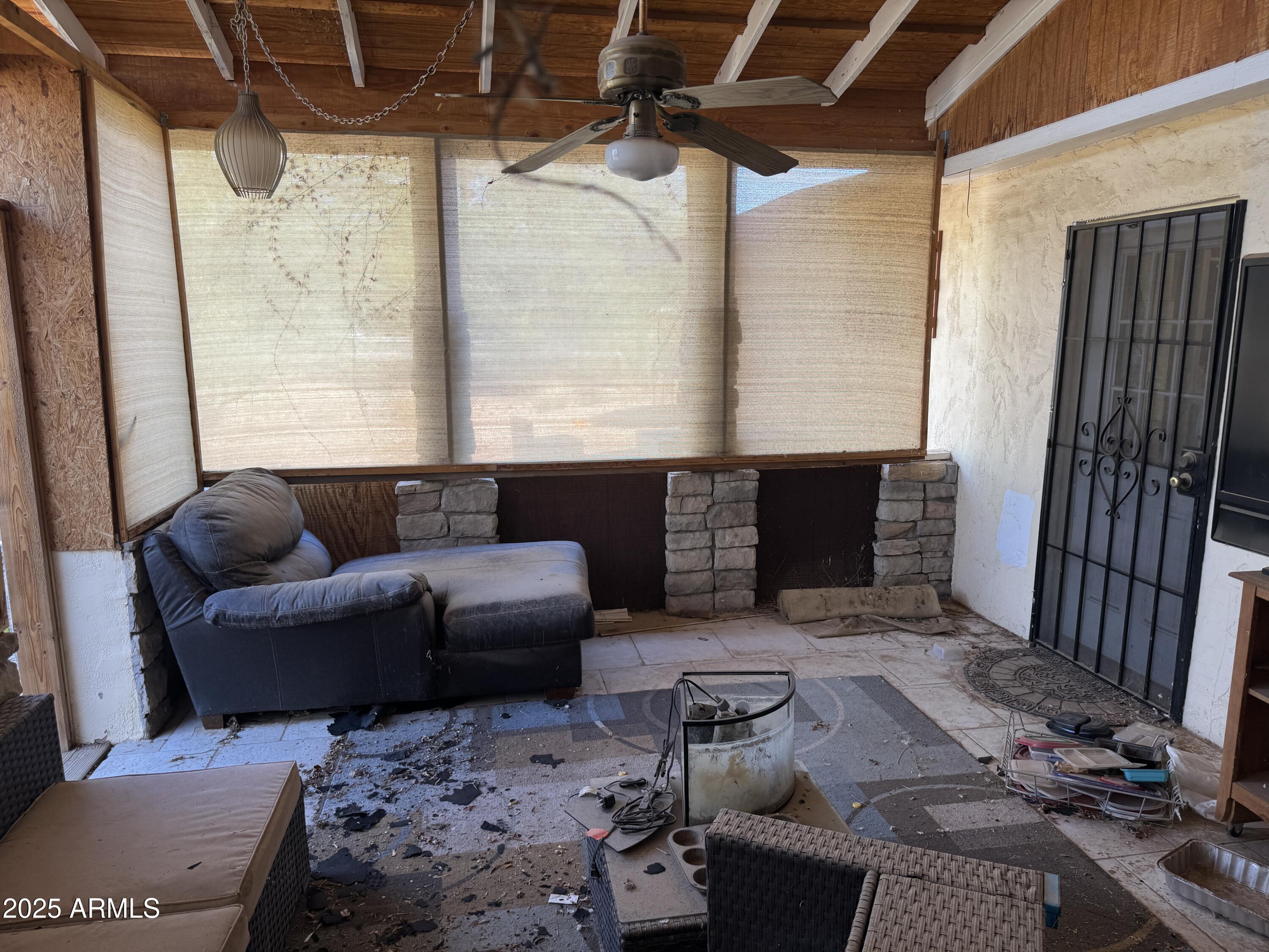 851 East Junction Street Apache Junction, AZ 85119 - Photo 9 of 13 a living room with furniture and a fireplace