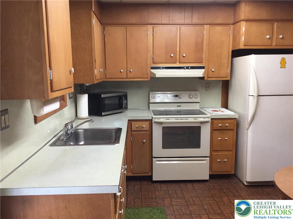 1105 Main Street Slatington, PA 18080 - Photo 11 of 31 A functional kitchen provides ample storage and essential appliances for everyday living.