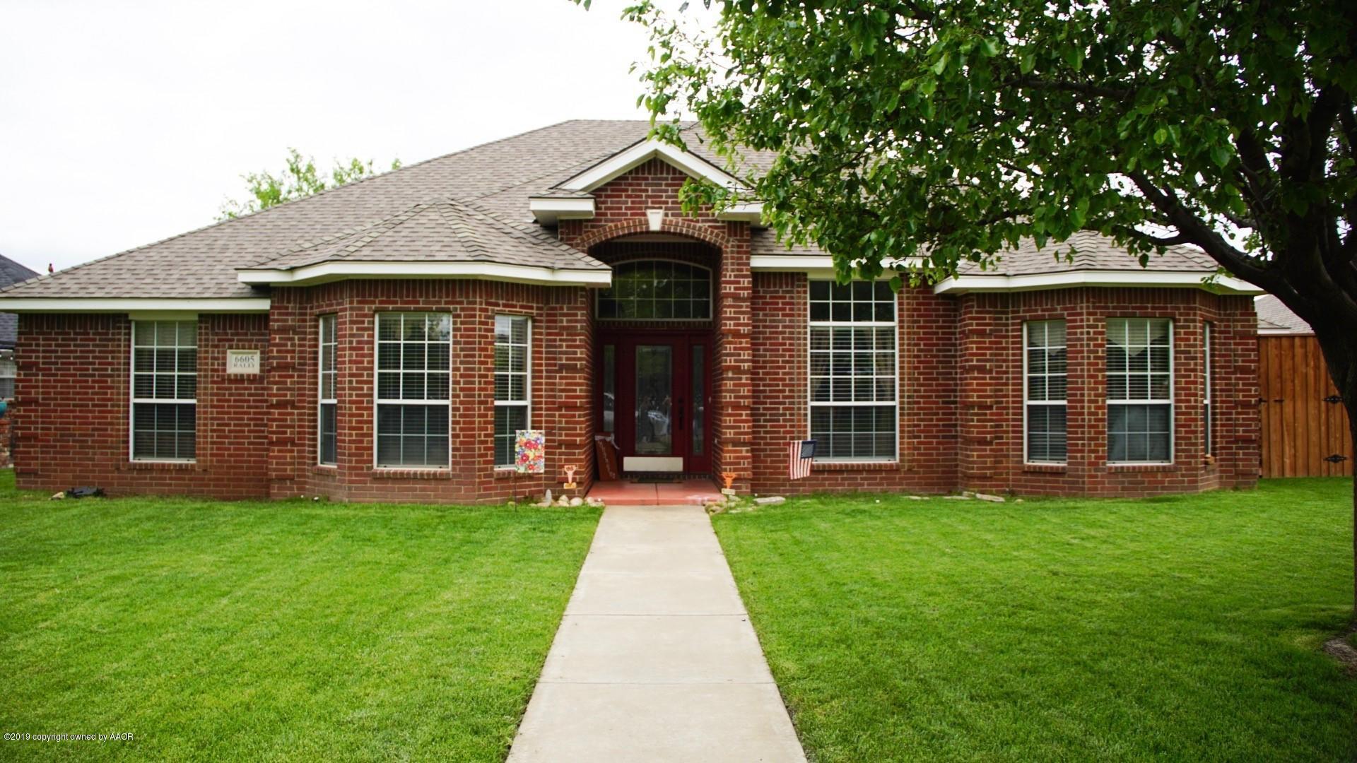 6605 Rally Road Amarillo, TX 79119 - Photo 1 of 21 a front view of a house with a yard