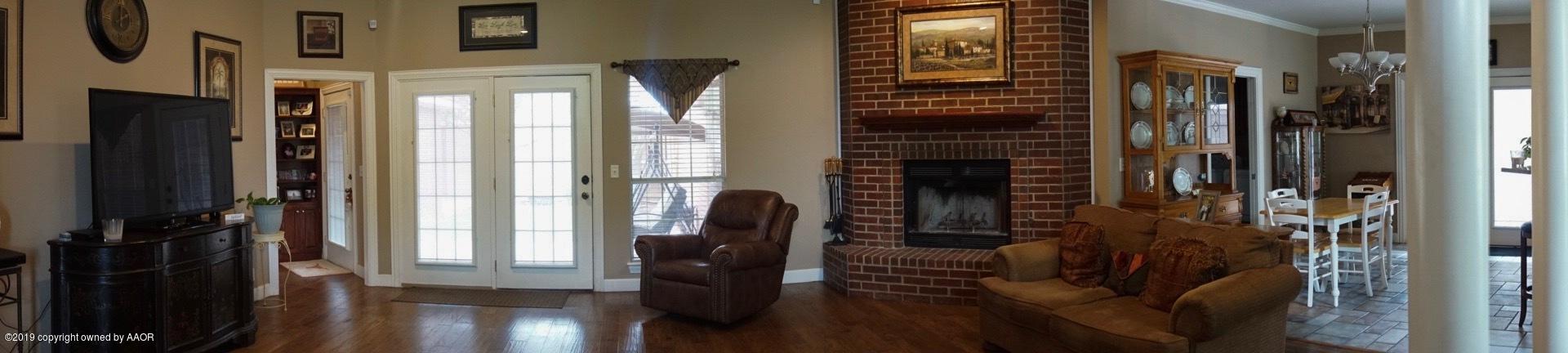 6605 Rally Road Amarillo, TX 79119 - Photo 13 of 21 a view of a entryway door with wooden floor