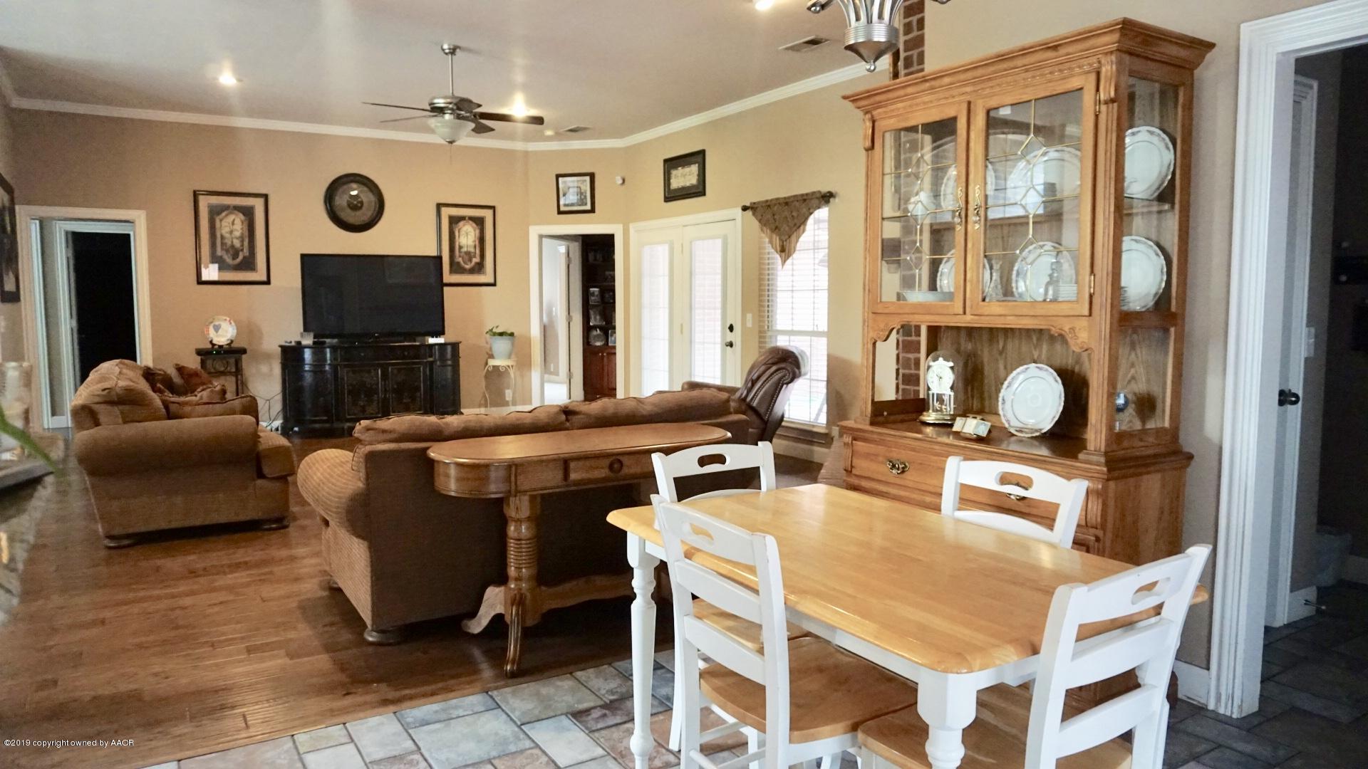 6605 Rally Road Amarillo, TX 79119 - Photo 3 of 21 a very nice looking living room with dining room and furniture