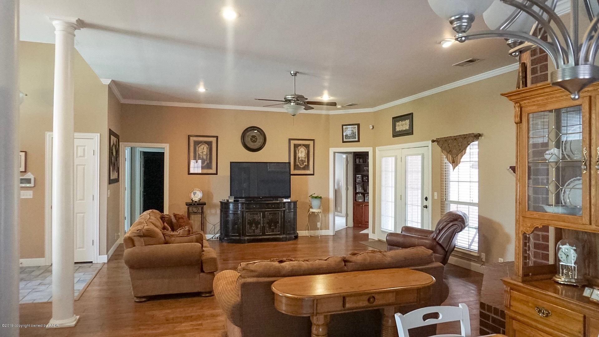 6605 Rally Road Amarillo, TX 79119 - Photo 5 of 21 a living room with fireplace furniture and a large window