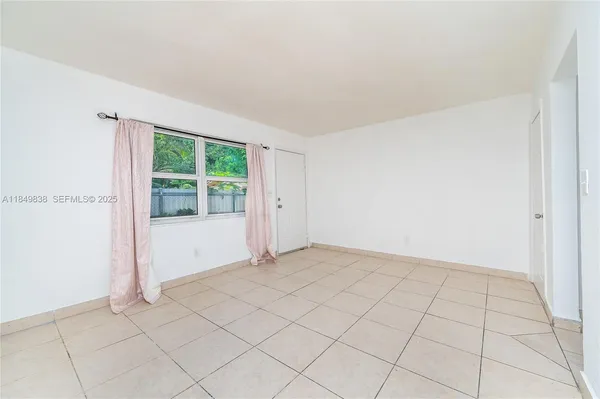 a view of an empty room and window