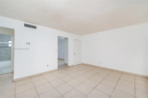 a view of an empty room and window
