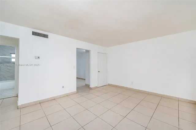 a view of an empty room and window