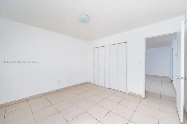 a view of an empty room and entryway