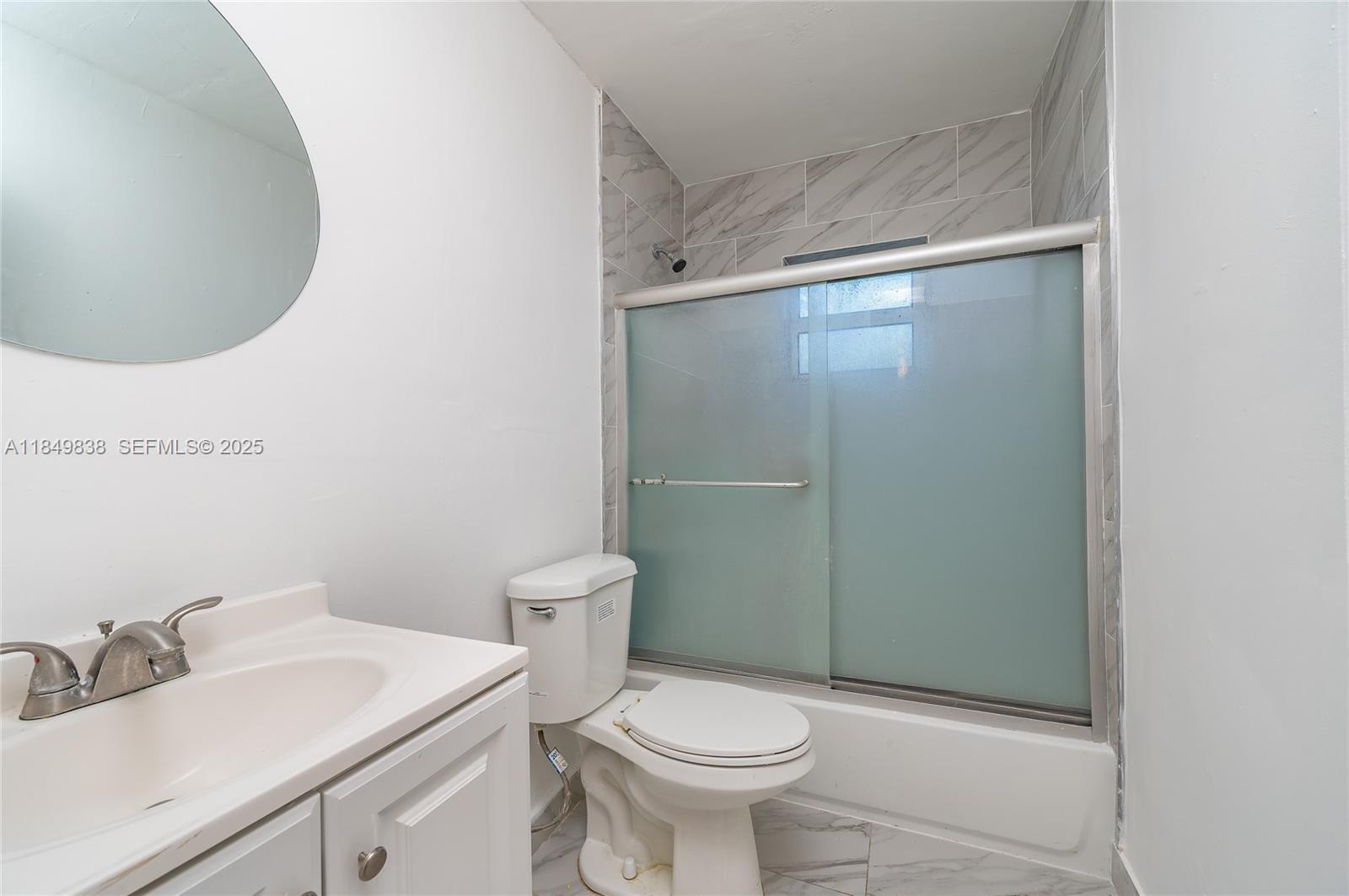 520 Southwest Krome Terrace, Unit 1 Homestead, FL 33030 - Photo 8 of 27 a bathroom with a sink and a toilet