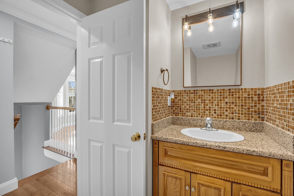 56 Honeysuckle Road Worcester, MA 01607 - Photo 12 of 27 a bathroom with a sink and a mirror