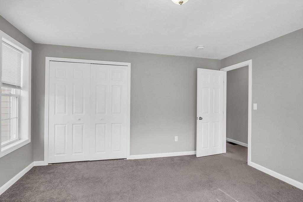 56 Honeysuckle Road Worcester, MA 01607 - Photo 15 of 27 a view of an empty room with a window