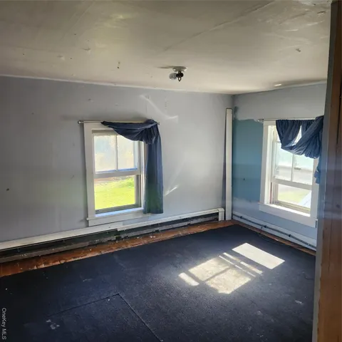 a view of entryway and hall with a window