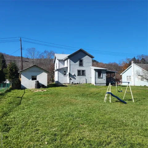 a view of a park with large trees