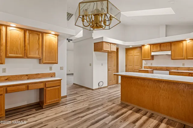 a view of a kitchen with a sink and a window