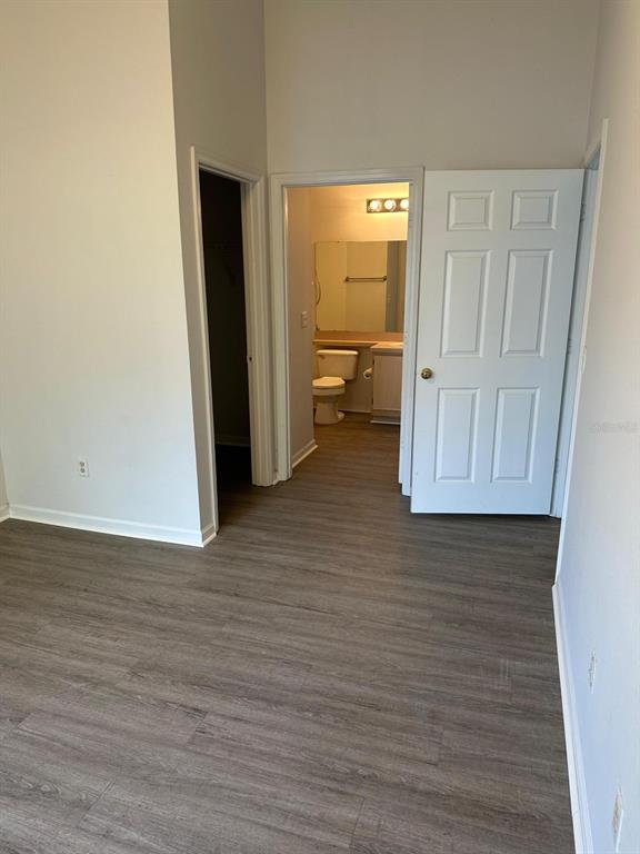 4352 South Kirkman Road, Unit 1204 Orlando, FL 32811 - Photo 13 of 22 a view of a room with wooden floor