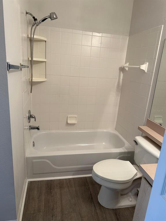 4352 South Kirkman Road, Unit 1204 Orlando, FL 32811 - Photo 22 of 22 a bathroom with a toilet and a bath tub