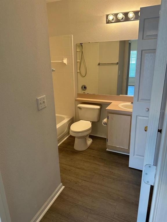 4352 South Kirkman Road, Unit 1204 Orlando, FL 32811 - Photo 5 of 22 a bathroom with a toilet and a shower