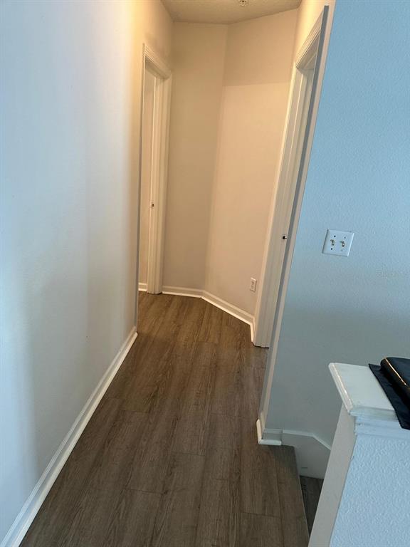 4352 South Kirkman Road, Unit 1204 Orlando, FL 32811 - Photo 8 of 22 view of a room with wooden floor