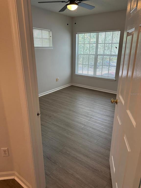 4352 South Kirkman Road, Unit 1204 Orlando, FL 32811 - Photo 9 of 22 a view of an empty room with a window