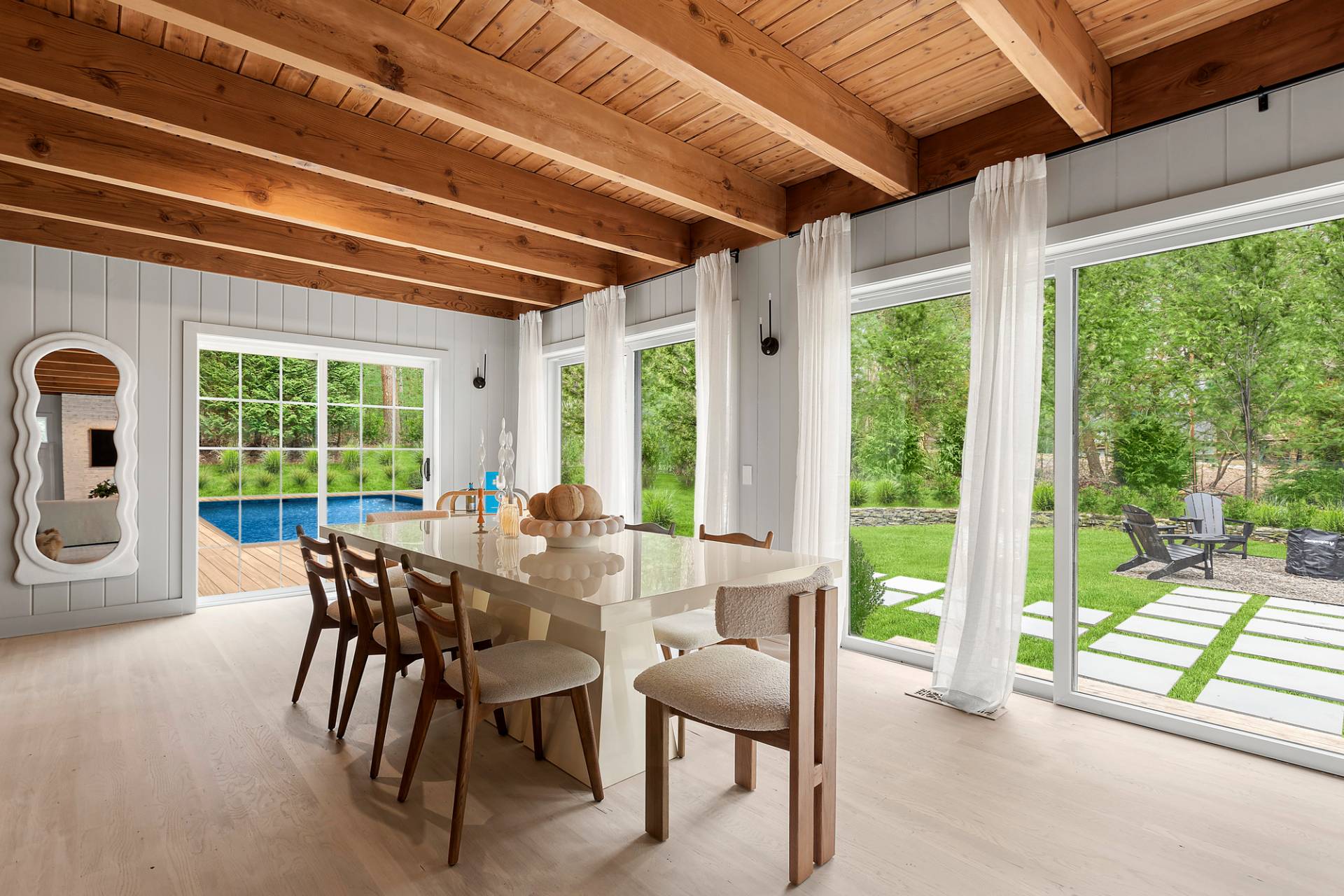 5 Phoebe Scoys Road East Hampton, NY 11937 - Photo 18 of 43 a view of a dining room with furniture window and outside view