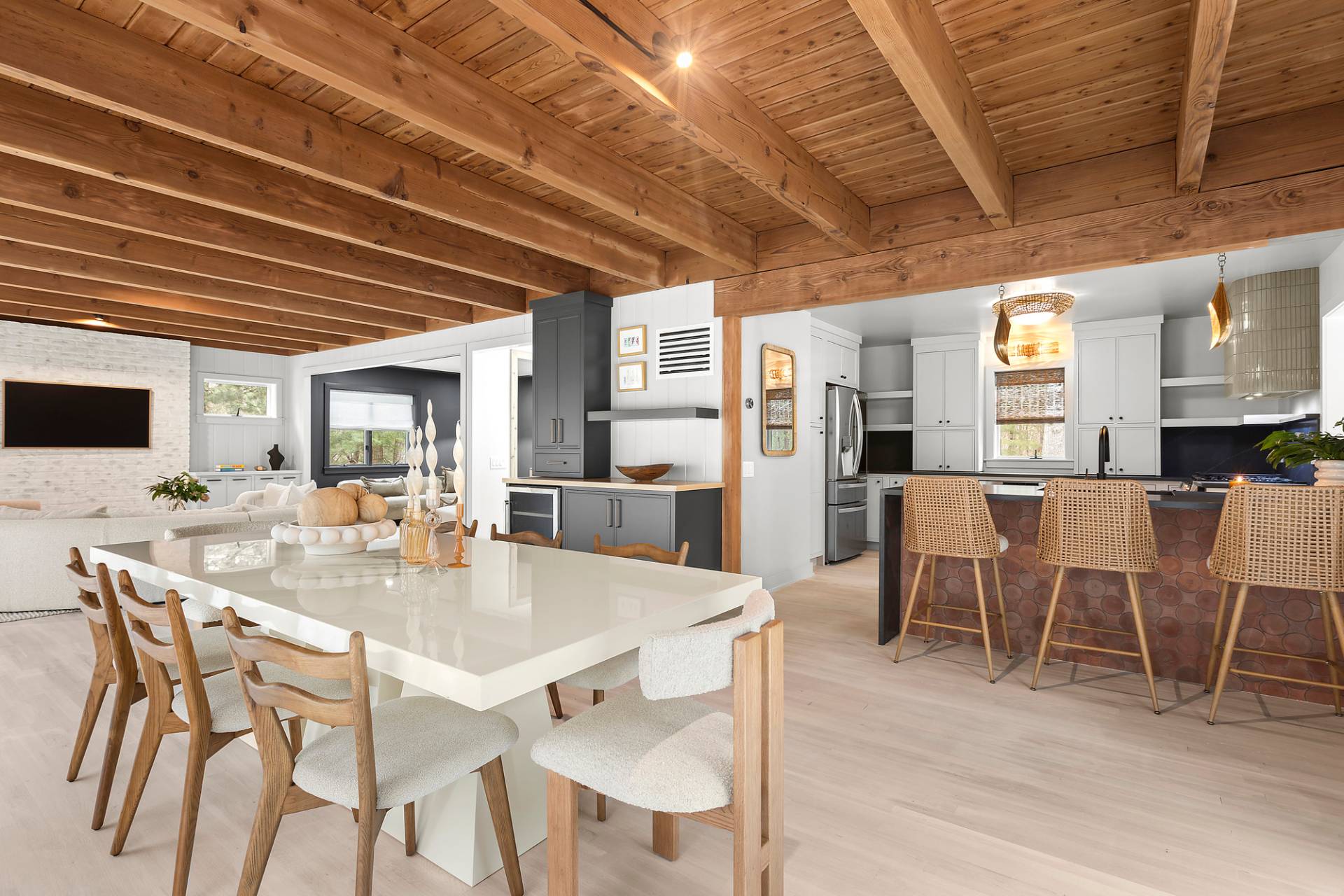 5 Phoebe Scoys Road East Hampton, NY 11937 - Photo 20 of 43 a dining room with furniture a rug and a kitchen view